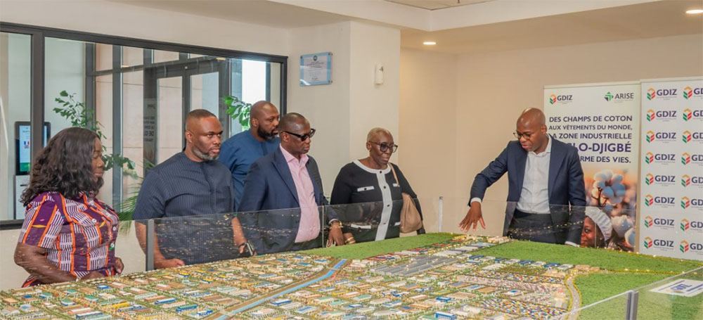 Delegation reviewing an industrial zone masterplan model